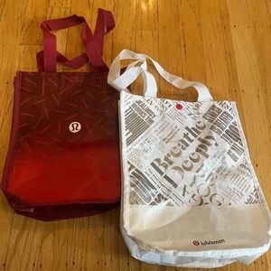 bundle of 1 small red Lululemon tote and 1 small white Lululemon tote